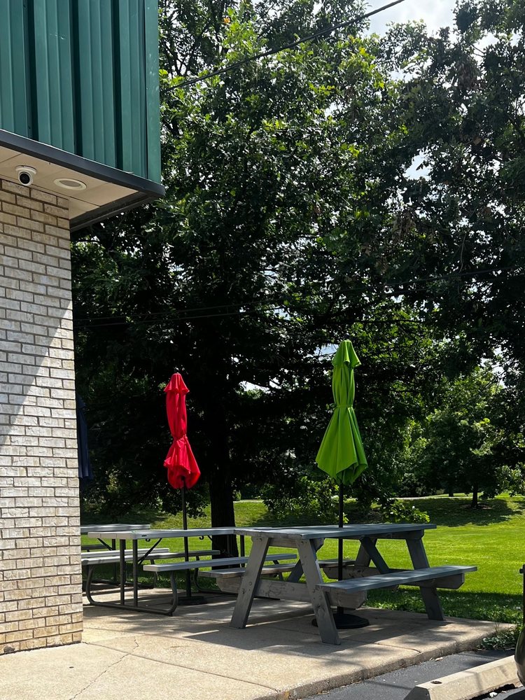 Shaded outdoor patio tables with umbrellas